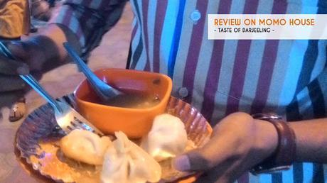 Reviews on Best Momo in kolkata-Customer tasting momo at momo house