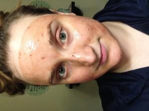 SkinFood Black Sugar Mask in Strawberry on face
