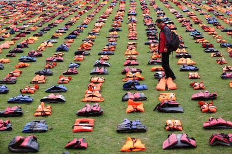 Parliament Square transformed into a 'graveyard of lifejackets' using 2,500 lifejackets worn by refugees crossing from Turkey to the Greek island of Chios surround Churchill's statue at Parliament Square, London. The event is in support of refugees and coincides with the UN Migration Summit.