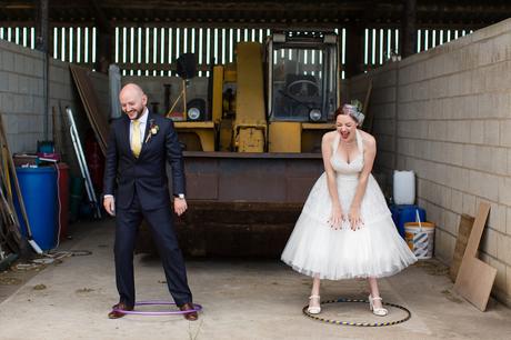 Barn Wedding tips Laughing At Hula Hoop Failure Bride & Groom