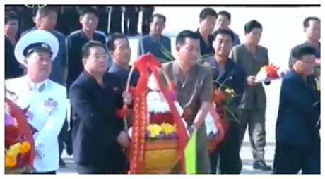 South Hamgyo'ng WPK Provincial Committee Chairman Kim Song Il [2nd left] delivers a floral basket to the KJS Statue at the Kim Jong Suk Naval Academy in South Hamgyo'ng Province on September 22, 2016 (Photo: Korean Central Television)