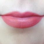 MCC Waterbean Glow Lipstick in Madarine Some on lips