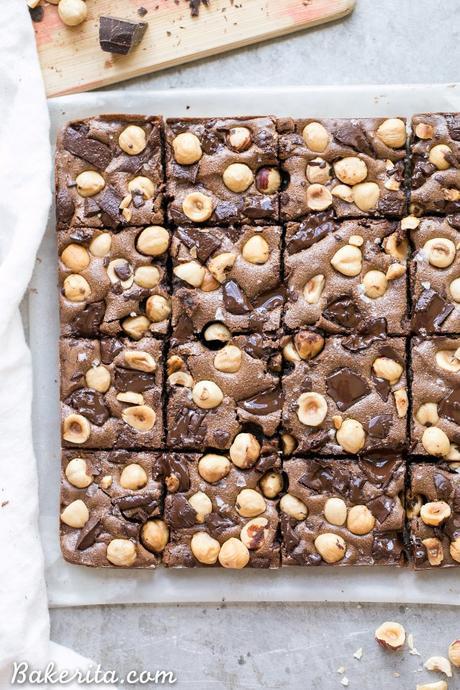 These Chocolate Hazelnut Bars have a hazelnut flour crust and are topped with dark chocolate chunks + crunchy hazelnuts. These gluten-free, Paleo + refined sugar free bars get even fudgier the day after they're made!