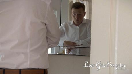 groom in liverpool being filmed putting cufflinks on