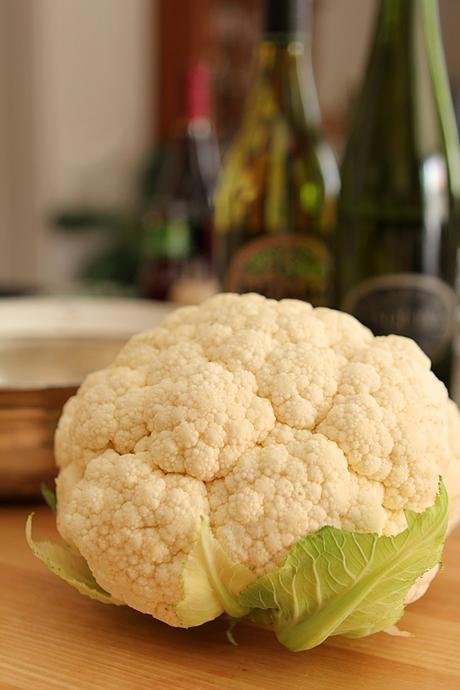 Whole Roasted Cauliflower with Parmesan and Cheddar Cheese Frosting