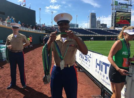 U.S. Marine awarding Omaha Marathon medal