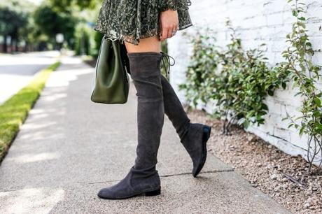 Amy Havins wears a Shoshanna dress paired with Stuart Weitzman gray over the knee boots.