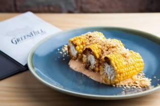 Charred corn on the cob with Crispy pork crumb and spicy buttermilk remoulade. Photo: Judit Losh