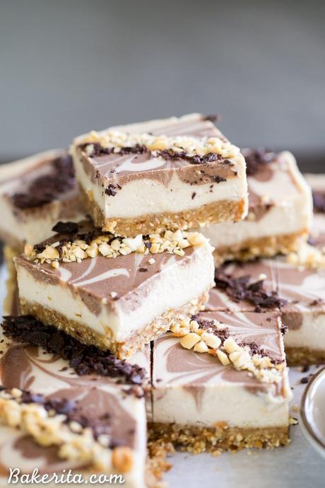 These No-Bake Chocolate Peanut Butter Cheesecake Bars have a peanut date crust and a super creamy cashew-based peanut butter filling - you'd never guess that they're vegan, gluten free, and refined sugar free!