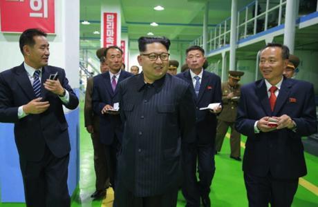Kim Jong Un tours a manufacturing area at Ryongaksan Soap Factory in western Pyongyang in an image seen top-center on the front page of the October 29, 2016 edition of the WPK daily organ Rodong Sinmun (Photo: Rodong Sinmun).