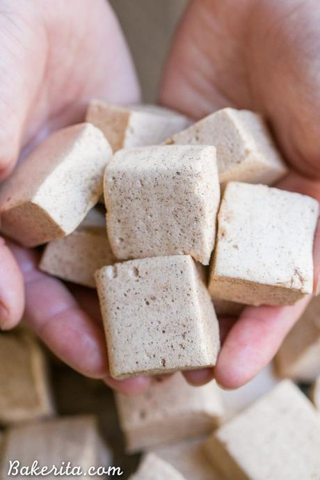 These Paleo Apple Spice Marshmallows are sweetened with maple syrup and flavored with apple juice + loads of warm spices! Homemade marshmallows are easier than you'd think, and you'll love these on their own or as the perfect apple cider addition.