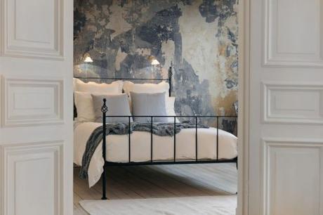 A rich, atmospheric mural resembling peeling layers of paint and distressed walls to give the look of an old, and much loved, interior.  