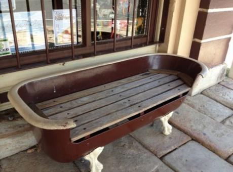 Bathtub repurposed as a bench