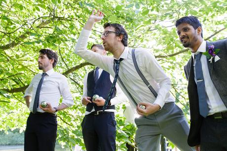 Guests play lawn games at wedding at East Riddlesden Hall