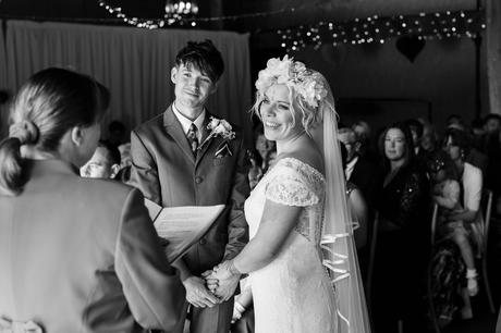 Boho bride with flower corwn during ceremony at East Riddlesden Hall