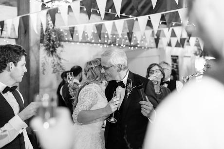Bride hugs dad after speeches at East Riddlesden Hal Wedding