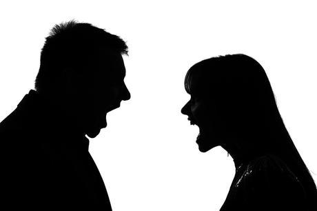 silhouette of a man and a woman in a heated argument