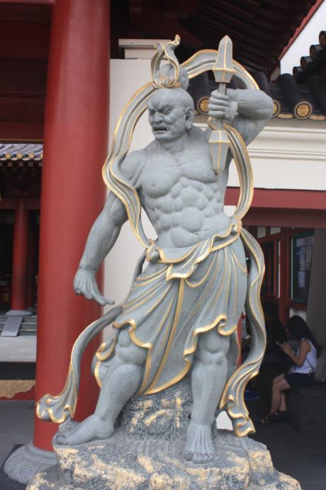 Guardian at front entrance. Note: Even if you have 6 pack abs, you're an 18 pack shy of being on par with this guy. 