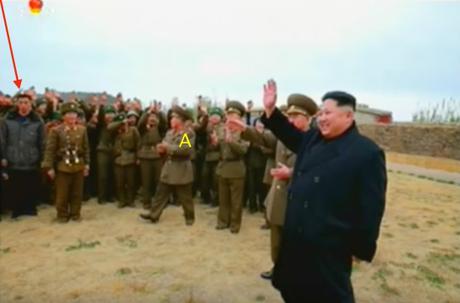 Kim Jong Un waves to KPA service members, officers and their families on Mahap Islet. Annotated is one of Jong Un's close protection escorts (bodyguards) and marked [A] is the head of the suryo'ng's security detail (Photo: Korean Central Television).