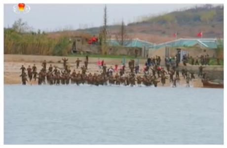KPA service members wade into the water as Kim Jong Un departs Mahap Islet (Photo: Korean Central Television).