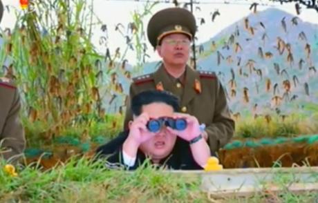Kim Jong Un watches the artillery exercise. Also in attendance is Director of the KPA General Staff Operations Bureau Colonel-General Ri Yo'ng-kil (Photo: Korean Central Television).