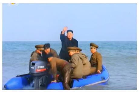 Kim Jong Un waves back to the KPA service members and their families as he departs Changjae Islet (Photo: Korean Central Television).
