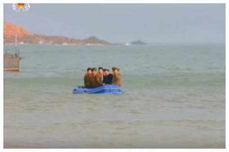 Kim Jong Un rides in a raft to Changjae Islet (Photo: Korean Central Television).