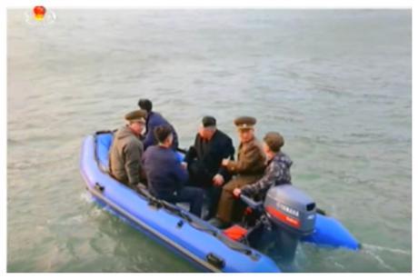 Kim Jong Un and senior members of the KPA high command Col. Gen. Ri Yo'ng-kil and Lt. Gen. Ri So'ng-kuk embark on a raft from his personal boat to Kali Islet (Photo: Korean Central Television).