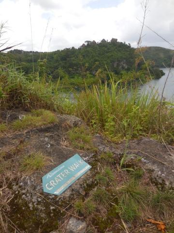 Signpost on rock Kyaninga Lodge. Crater rim walk