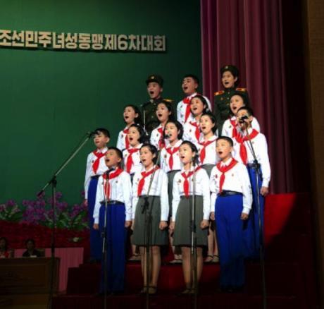 Representatives of the Korean Children's Union make a congratulatory presentation during the Women's Union's 6th Congress in a photo which appeared top-center of page 7 of the November 19, 2016 edition of the WPK daily organ Rodong Sinmun (Photo: Rodong Sinmun).