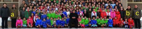 Kim Jong Un poses for a commemorative photograph with DPRK children who go to the Samjiyo'n County Schoolchildren's Palace.  In attendance are WPK Central Committee Department Director Kim Yo'ng-su [a], WPK Vice Chairman Ch'oe Ryong-hae and Yanggang WPK Provincial Committee Chairman Ri Sang-wo'n (Photo: Rodong Sinmun).