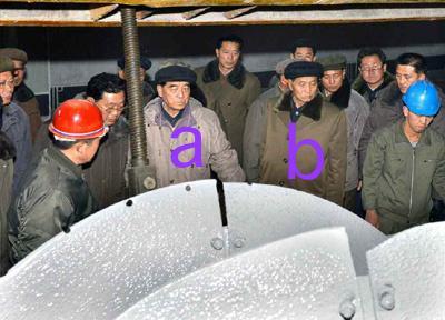 DPRK Premier Pak Pong Ju [a] visits the Komdok Mining Industry Complex in South Hamgyo'ng.  Also in attedance is WPK Vice Chairman for Planning and Finance Kwak Pom Gi [b], among other heavy hitters (Photo: Rodong Sinmun).