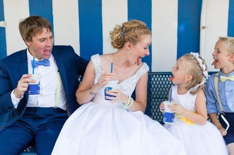 Bride, groom and flower girl all making silly faces Tips for Children at Weddings