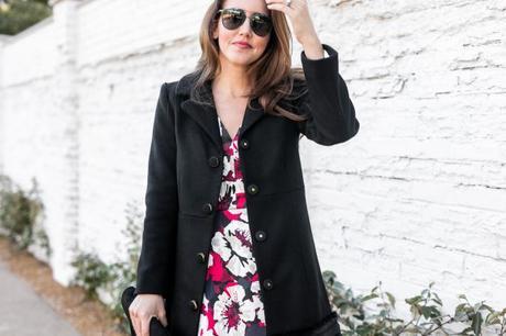 Amy Havins shares her holiday style by wearing a floral fit and flare draper james dress.