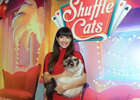 Actress Hannah Simone poses with Wylie Coyote Super Genius, the winner of America's Next Shuffle Cat contest, after a live cat-walk in New York, Tuesday, Dec. 6, 2016.  Wylie will be featured in Shuffle Cats, the new mobile game from King.  (Photo by Diane Bondareff/Invision for King/ AP Images) (PRNewsFoto/King)