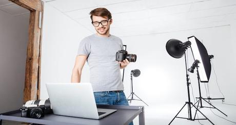 Photographer using laptop computer