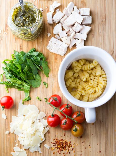 This pesto chicken mug pasta cooks up in the microwave in under 10 minutes for an easy and healthy lunch, dinner for one, or a dorm room meal.