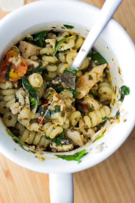 This pesto chicken mug pasta cooks up in the microwave in under 10 minutes for an easy and healthy lunch, dinner for one, or a dorm room meal.