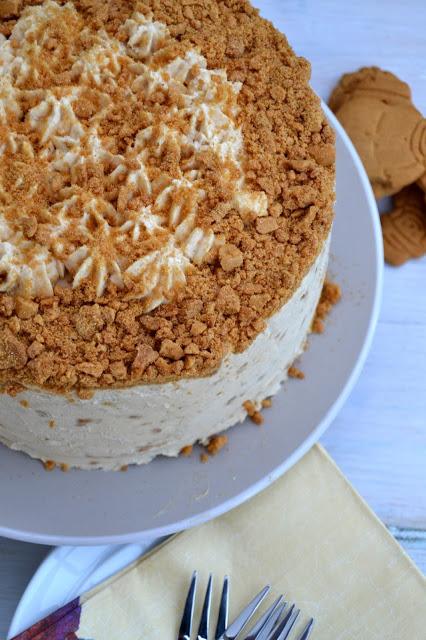 Dark gingerbread cake with cream cheese frosting incorporating crushed ginger nut biscuits