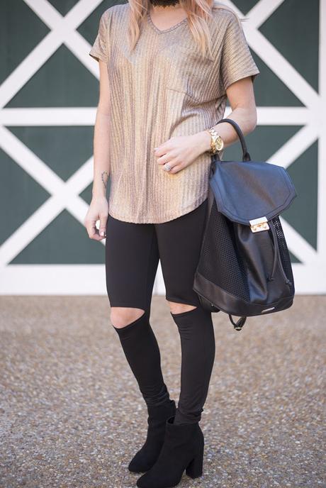 New Years Eve Looks: Casual featuring a sparkly gold top, black cutout leggings and black booties. Minimum jewelry with a black lace choker and gold watch. 