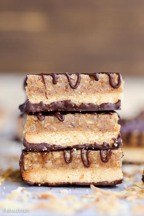 These Samoa Bars have a shortbread crust, a layer of toasted coconut caramel, and a dark chocolate drizzle! They're a gluten-free, Paleo, vegan, and guilt-free way to enjoy your favorite Girl Scout cookie.