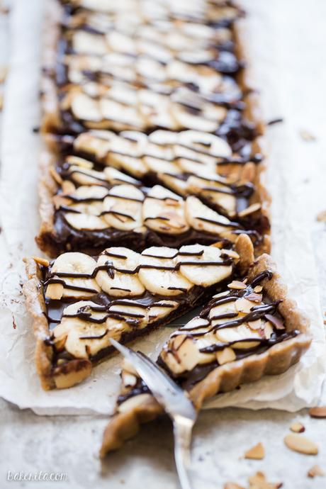 This No-Bake Chocolate Banana Tart has an easy date crust, filled with creamy chocolate ganache and sliced bananas! This quick and simple recipe is only has five ingredients and it's gluten-free, Paleo and vegan.