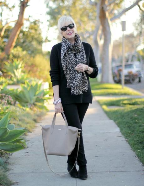 all-black outfit with neutral accessories