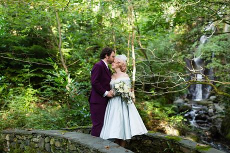 Groom kisses bride on forehead Derwentwater Independent Hostel Wedding