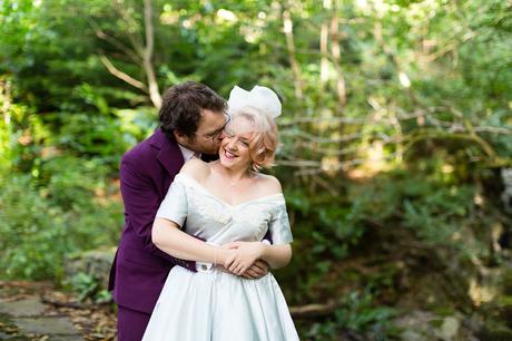 Groom cuddles bride Derwentwater Independent Hostel Wedding