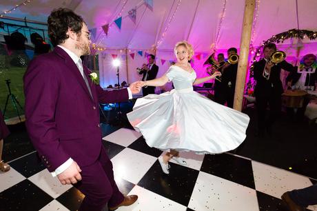 Twirly blue wedding dress dancing on chequerboard floor Derwentwater Independent Hostel Wedding