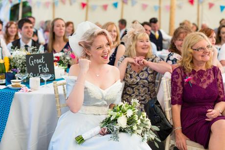 Bride in blue dress does fist pump Derwentwater Independent Hostel Wedding