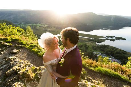 Bride in groom in sunset overlooking lake Derwentwater Independent Hostel Wedding