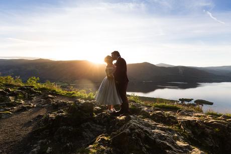 Bride & groom kiss in sunset Derwentwater Independent Hostel Wedding