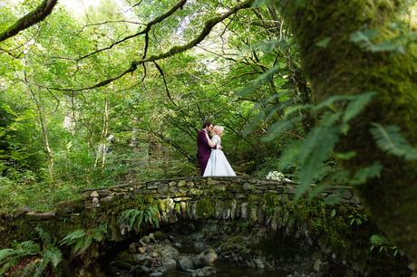 Bride & groom on bridge Derwentwater Independent Hostel Wedding